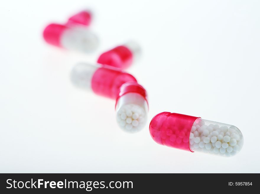 Pills on the white background