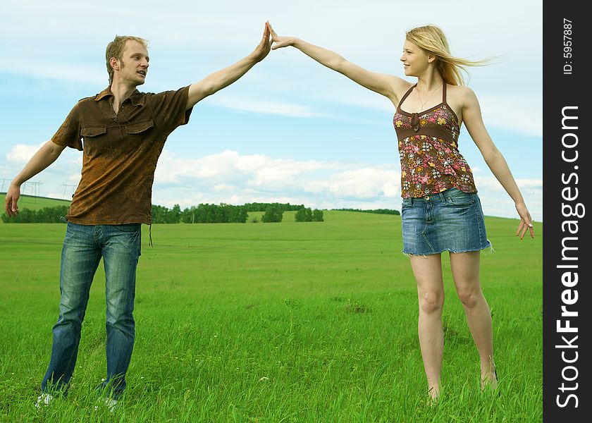 Young Couple Playing Around In The Nature