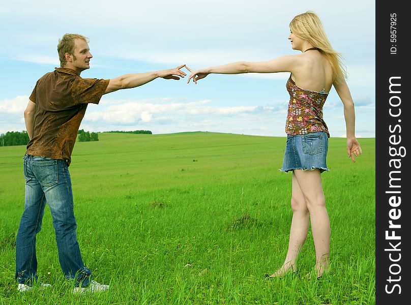 Young Couple Playing Around In The Nature