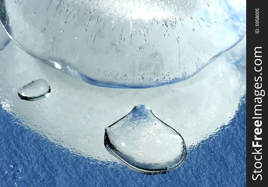 Ice cube on mirror as background