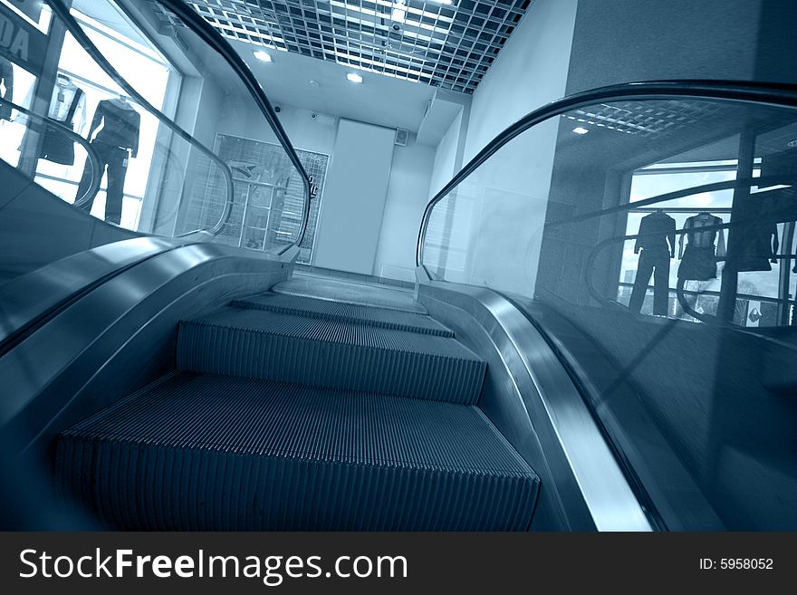 Escalator stairs in blue tone