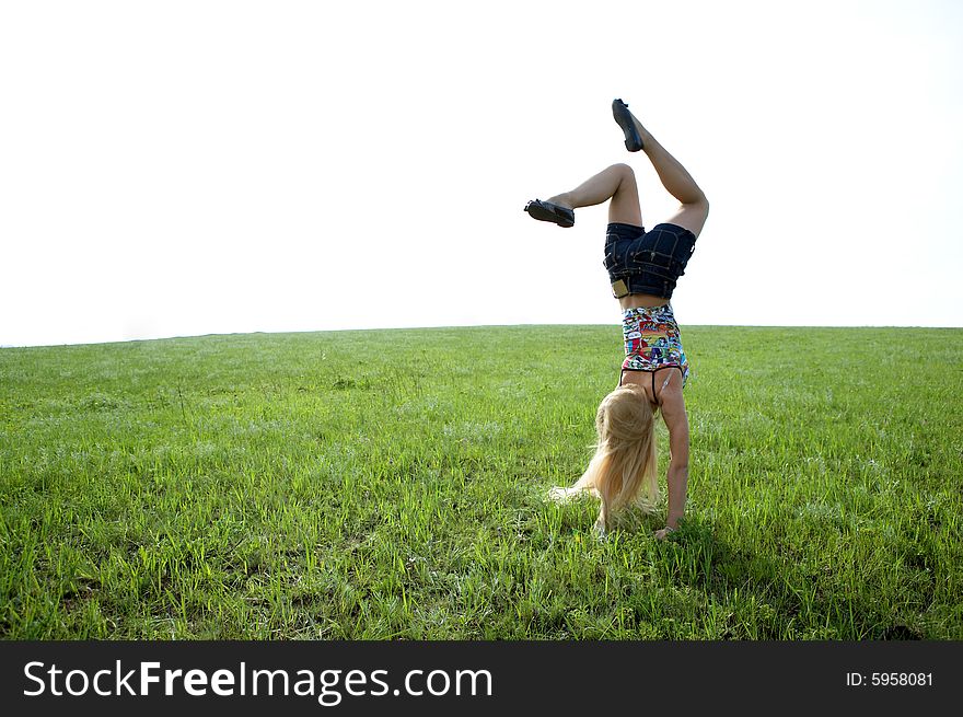 Happy beauty young woman jump in field