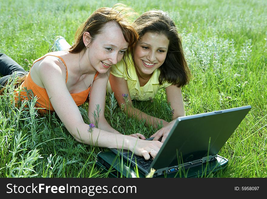 Two Beautiful Girls With Laptop Computer