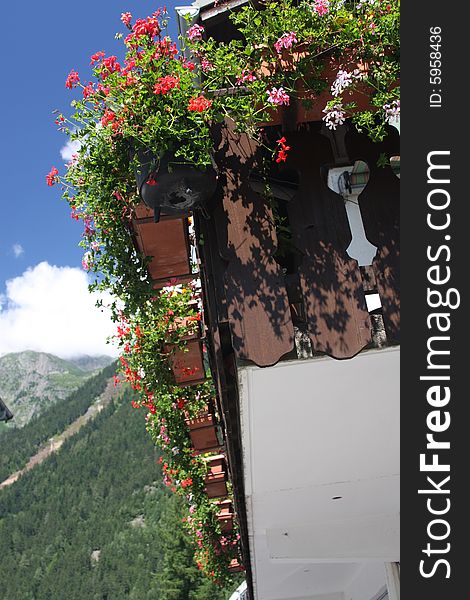 Balcony dressed with summer flowers, looking towards the mountains. Balcony dressed with summer flowers, looking towards the mountains