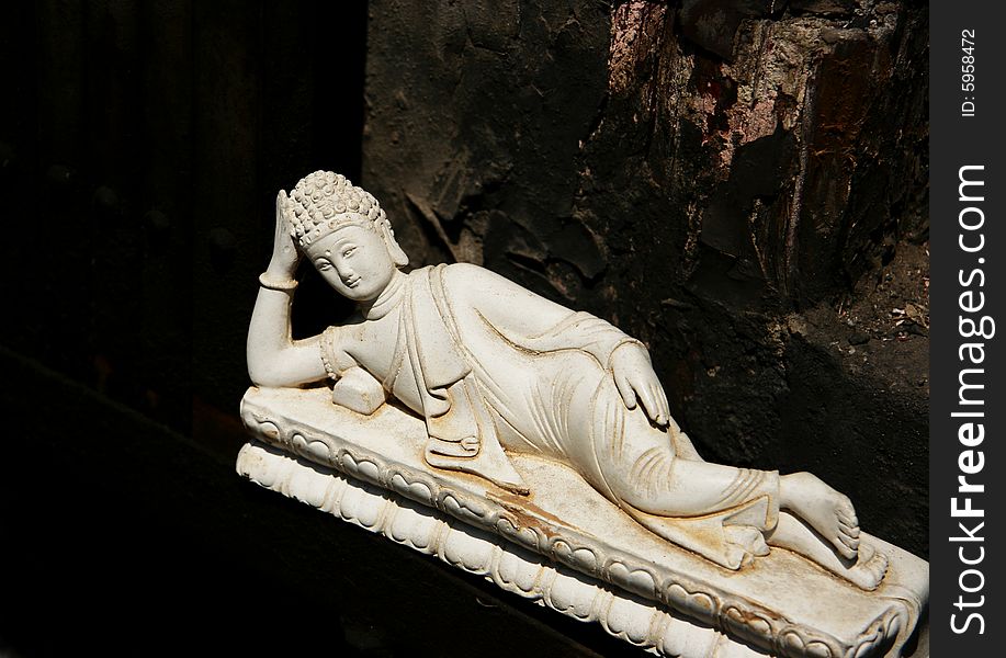 Stone carved buddha lying  figure