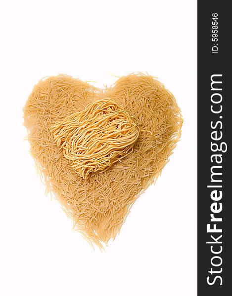 Noodles as heart on white background