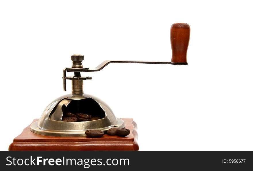 Old-fashioned coffee grinder with coffee beans