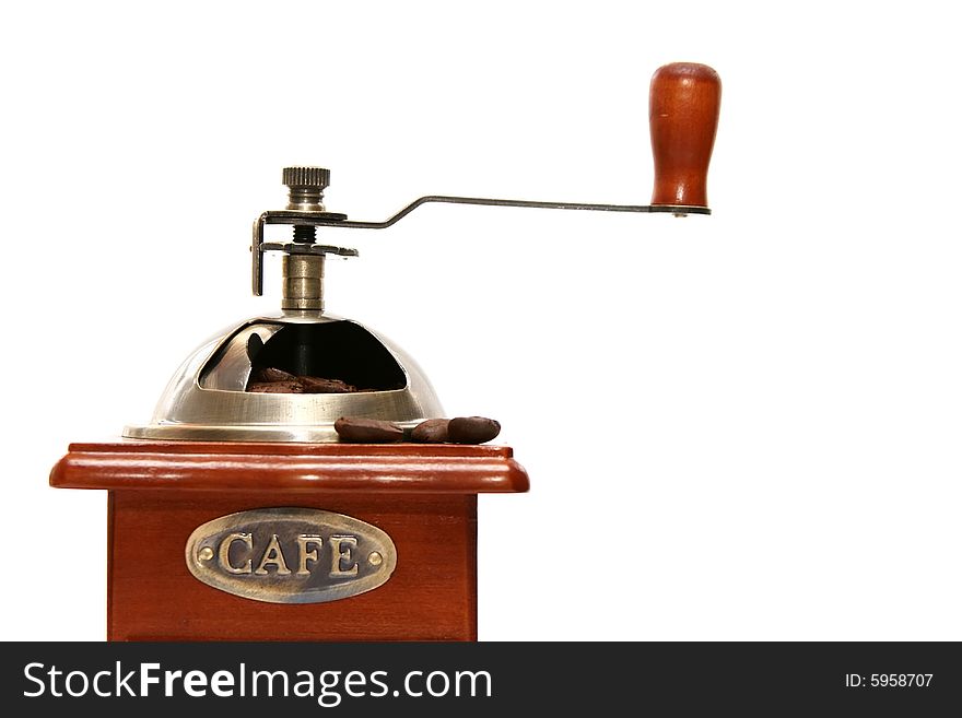 Old-fashioned coffee grinder with coffee beans