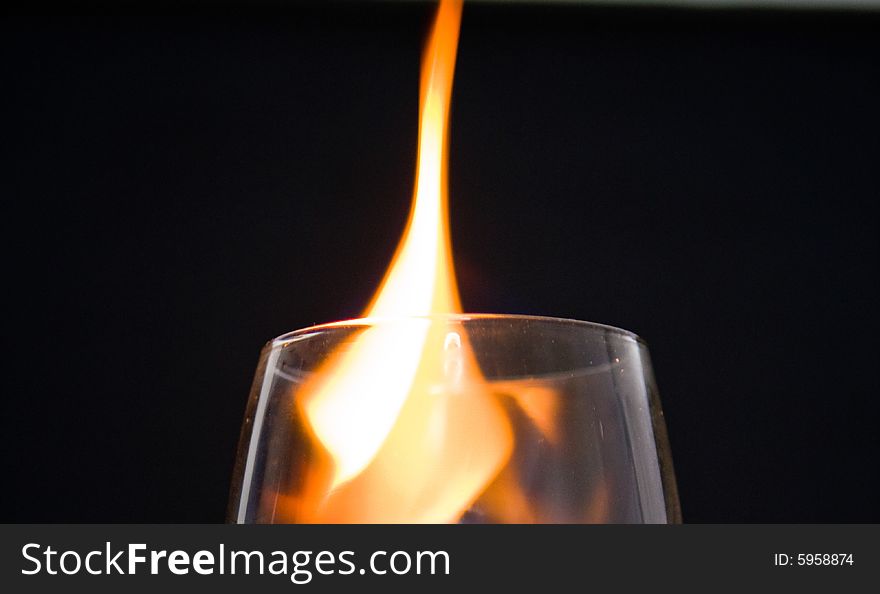 Fire burning in a wine glass. Fire burning in a wine glass