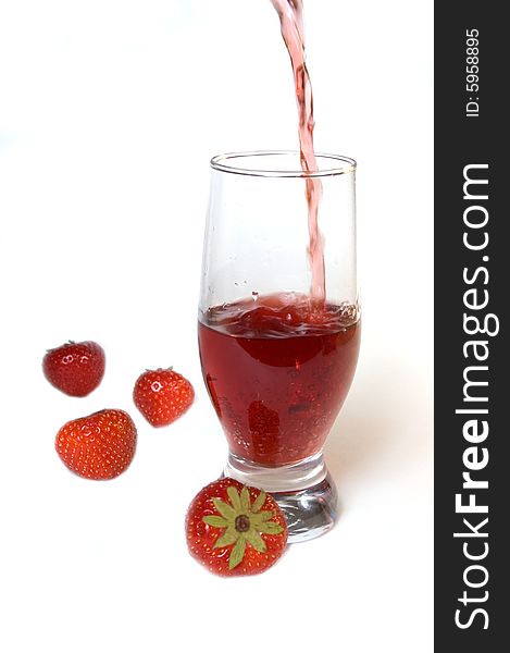 Red champagne in a glass with strawberries, isolated on white