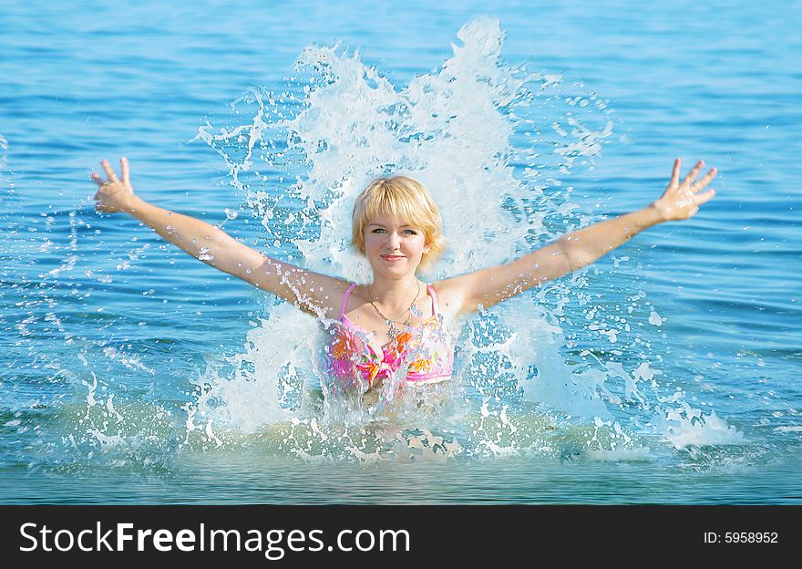 Beautiful girl in a bathing suit on a beach. Beautiful girl in a bathing suit on a beach