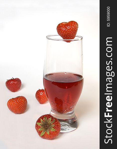 Red champagne in a glass with strawberries, isolated on white. Red champagne in a glass with strawberries, isolated on white