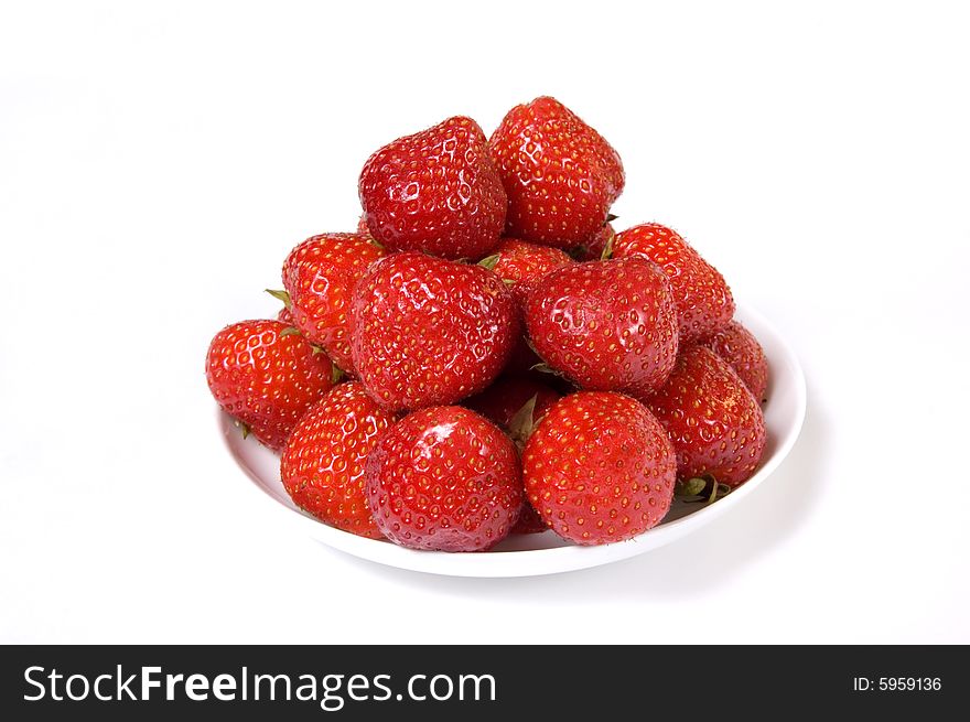 Fresh and tasty strawberries in a plate, isolated on white