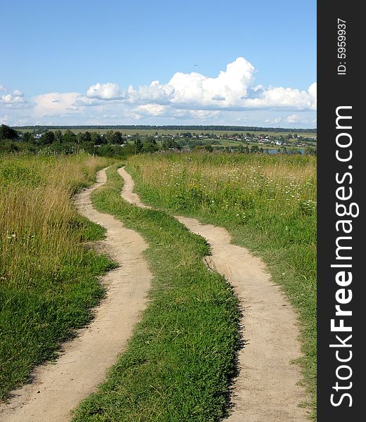 Country earth road to the river