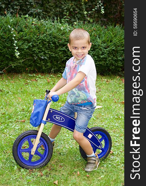 Cute Little Boy On A Bike