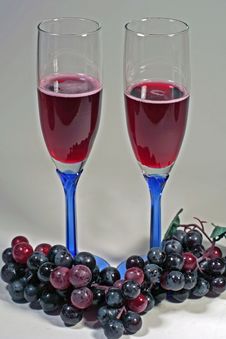 Glasses Of Red Wine & Red Grapes Stock Image Glasses Of Red Wine & Red Grapes Stock Image