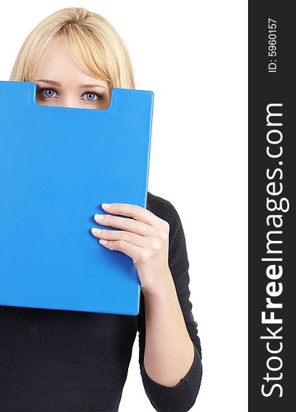 Beautiful blonde businesswoman holding the blue folder in front of her face, hiding from her boss. Isolated on white background