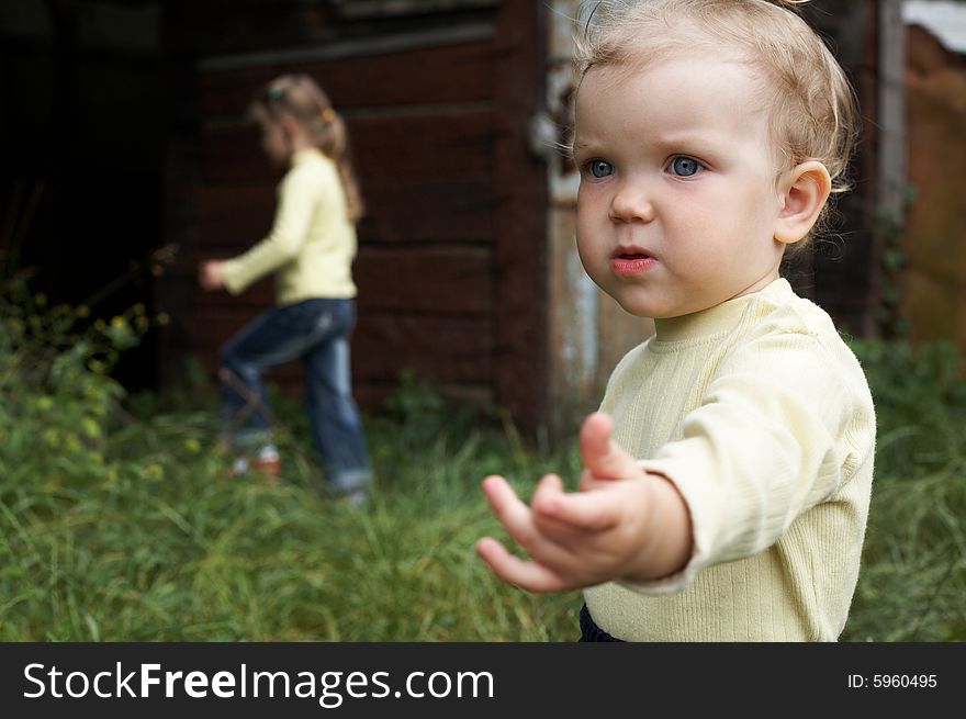 An image of little girl walking with her sister. An image of little girl walking with her sister