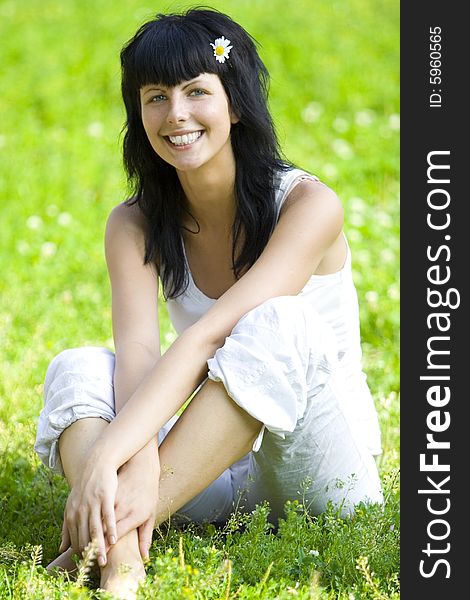 Woman Sitting On Grass