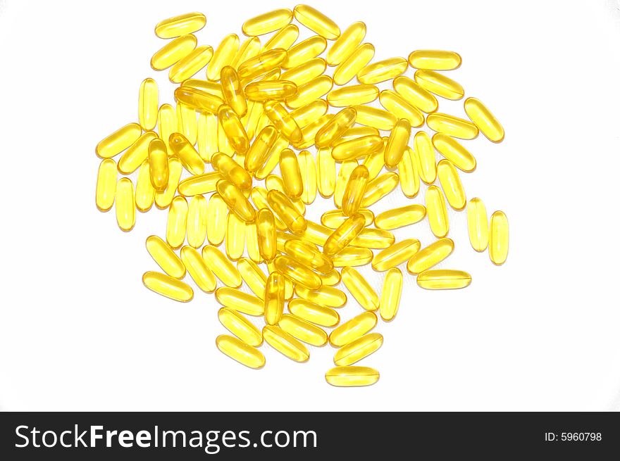 Yellow vitamins isolated on white