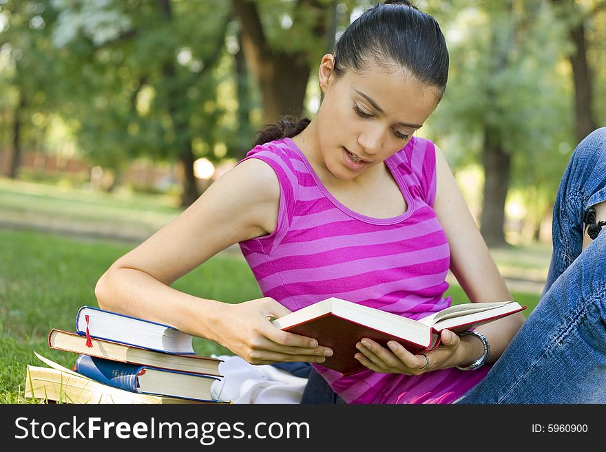 Young Woman Reading Outdoor