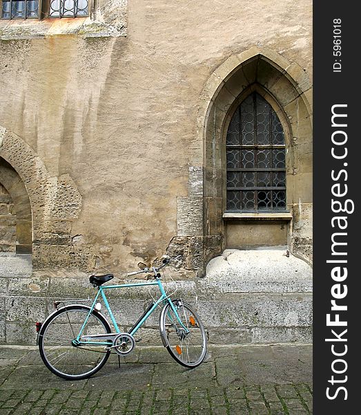 Beautiful old church, bike and cobblestone street in central Germany. Beautiful old church, bike and cobblestone street in central Germany.