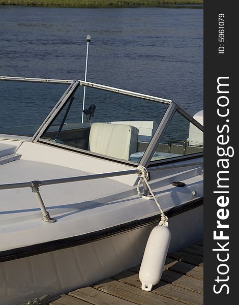 Close up of a white docked speed boat on the Delaware River. Close up of a white docked speed boat on the Delaware River