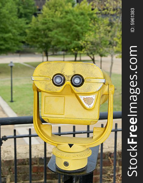 Commercial grade sightseeing binoculars at a scenic overlook.