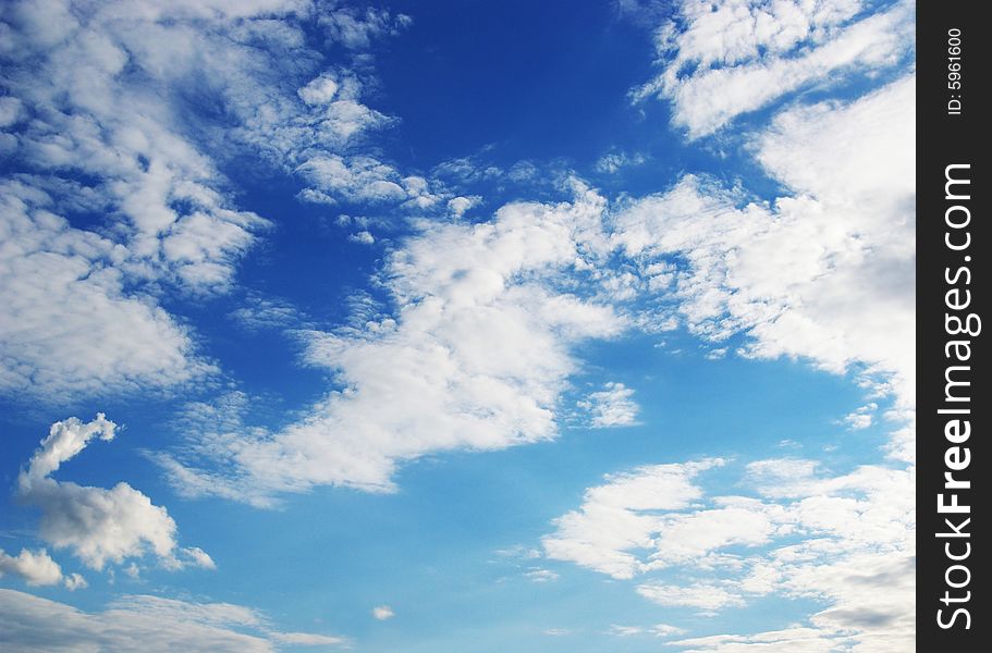 White clouds in a blue sky. Great background. White clouds in a blue sky. Great background