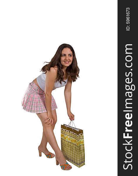 A beautiful girl in a mini skirt, holding a cardboard sack in her hands. A beautiful girl in a mini skirt, holding a cardboard sack in her hands