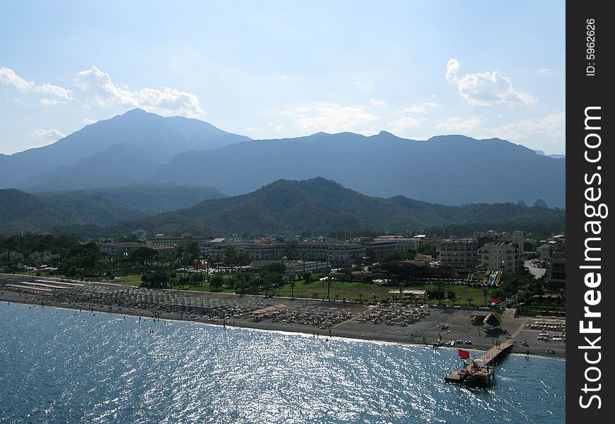 An aeroview of a mountain beach scene.