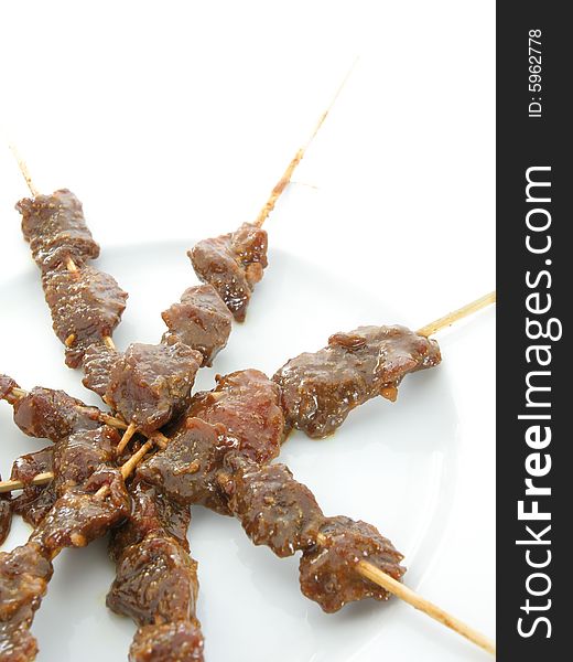 Satay or sate dice-sized meat on bamboo skewer