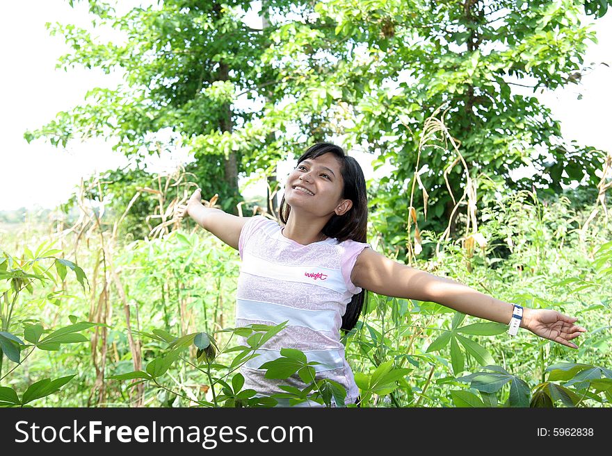 Girl in field and enjoy the fresh air. Girl in field and enjoy the fresh air