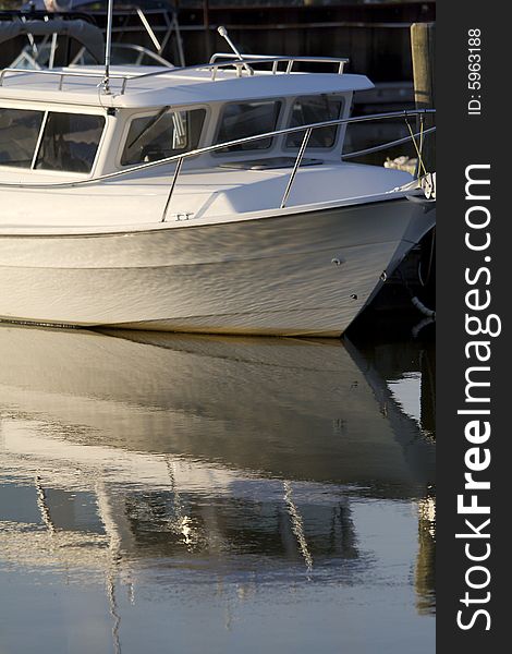 Reflection of boat in the calm water. Reflection of boat in the calm water