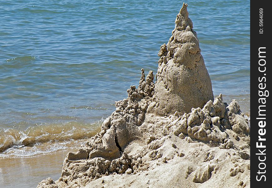 Unique sandcastle built on the beach. Unique sandcastle built on the beach.