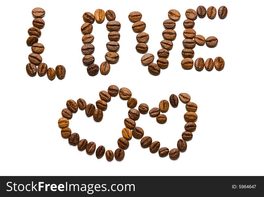 Photo of  word love and two hearts made of coffee beans.  Isolated over white. Photo of  word love and two hearts made of coffee beans.  Isolated over white.