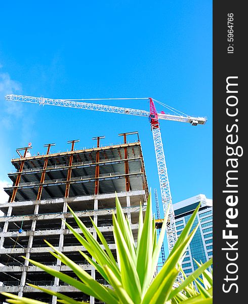 Construction crane with blue sky background