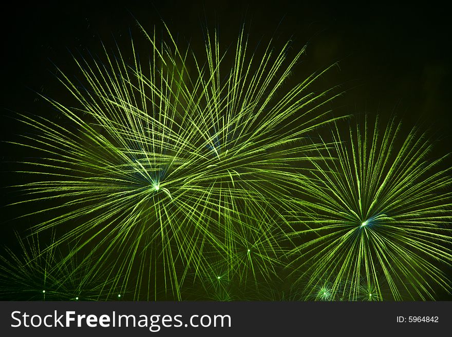 Green fireworks stars in black sky. Green fireworks stars in black sky