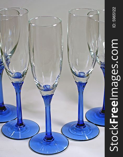 Triangle Of Shiny Blue Wine Glasses