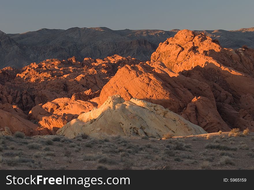 Red rocks called Valley of Fire with the backdrop of black mountains. Red rocks called Valley of Fire with the backdrop of black mountains