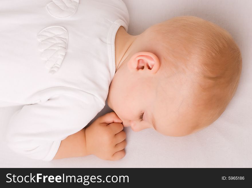 One year old baby boy asleep with angel wings. One year old baby boy asleep with angel wings