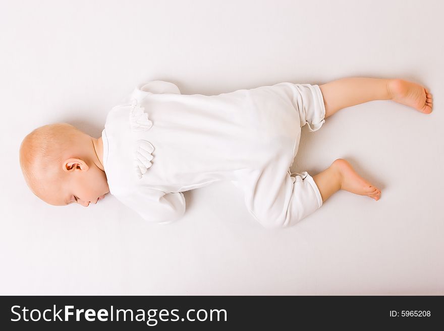 One year old baby boy asleep with angel wings. One year old baby boy asleep with angel wings