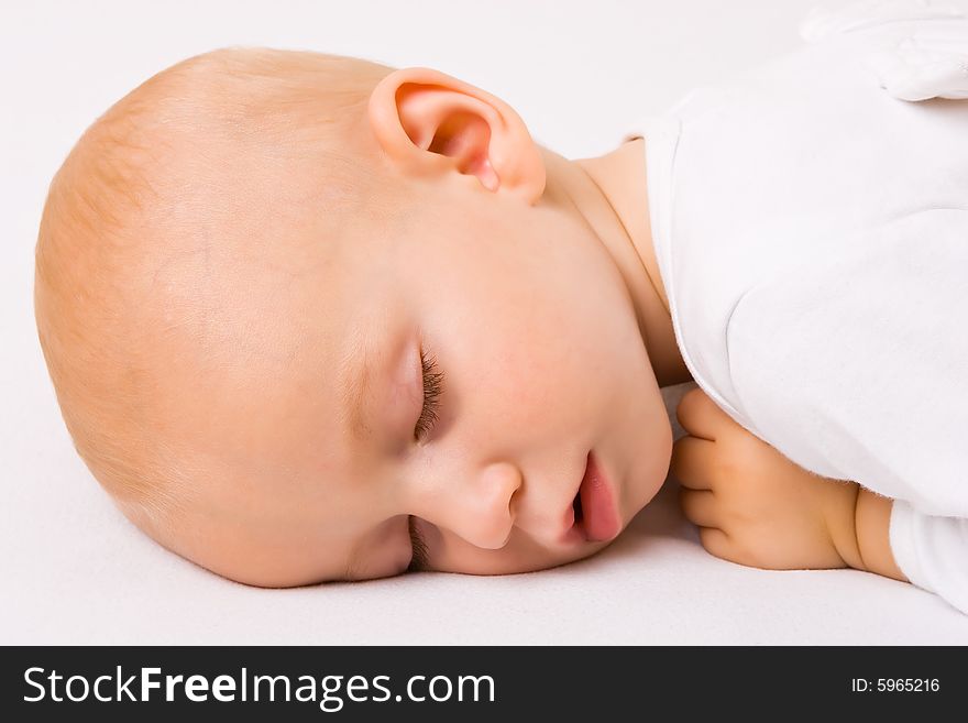 One year old baby boy asleep with angel wings. One year old baby boy asleep with angel wings