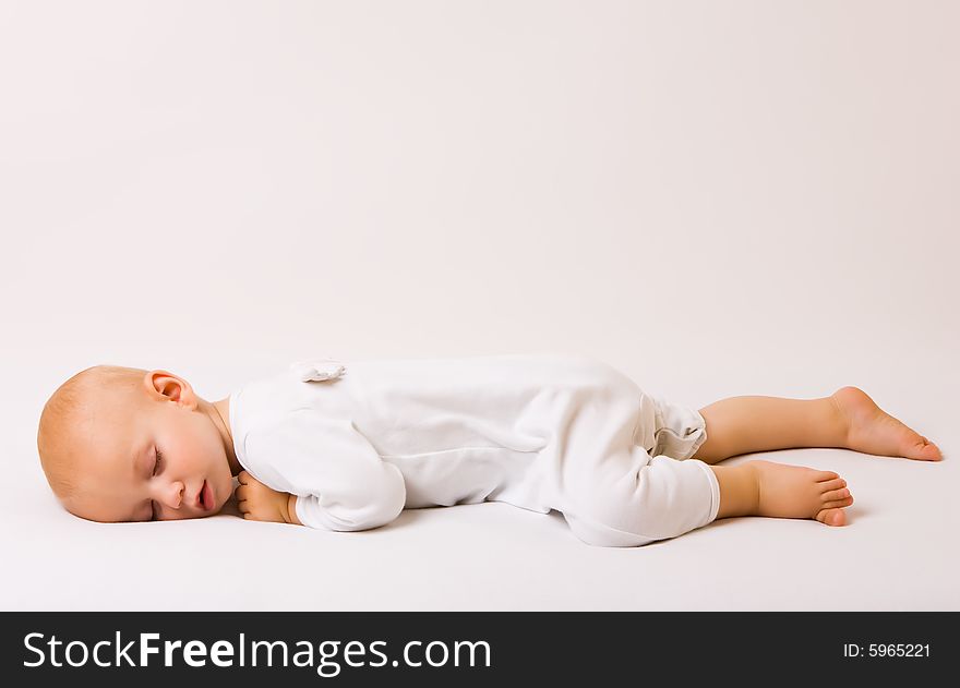 One year old baby boy asleep with angel wings. One year old baby boy asleep with angel wings