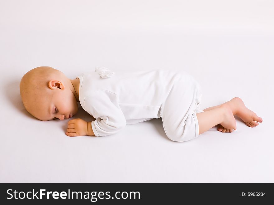 One year old baby boy asleep with angel wings. One year old baby boy asleep with angel wings