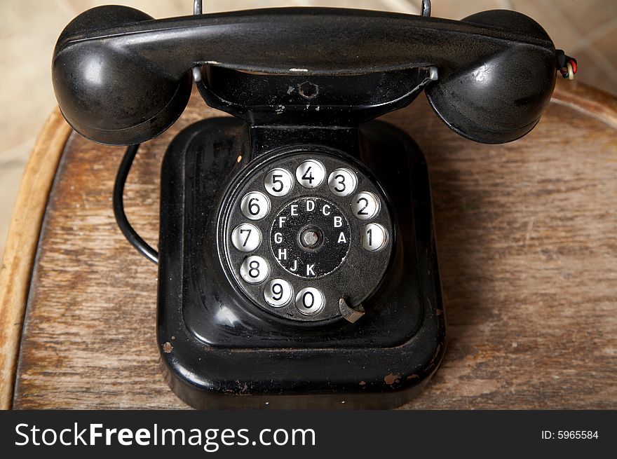 An image of black retro telephone in the studio. An image of black retro telephone in the studio.