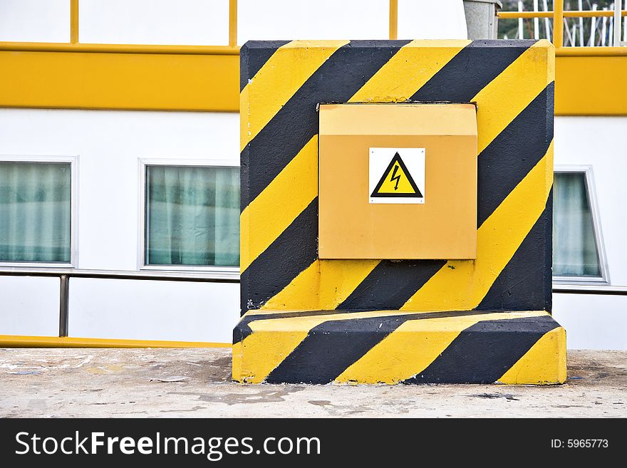 Brightly coloured power box on pier