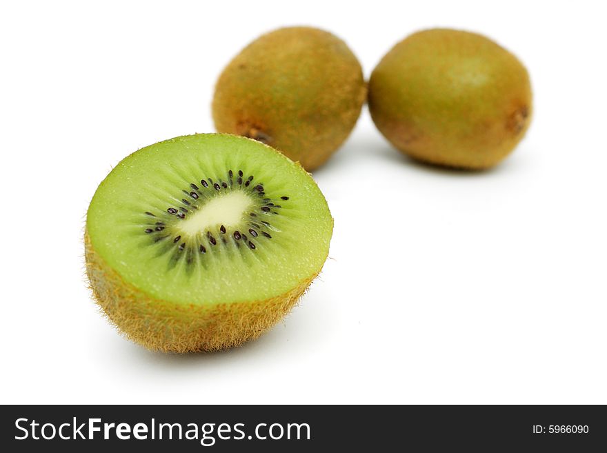 Close up of half kiwi fruit isolated from the others on white background. Close up of half kiwi fruit isolated from the others on white background.