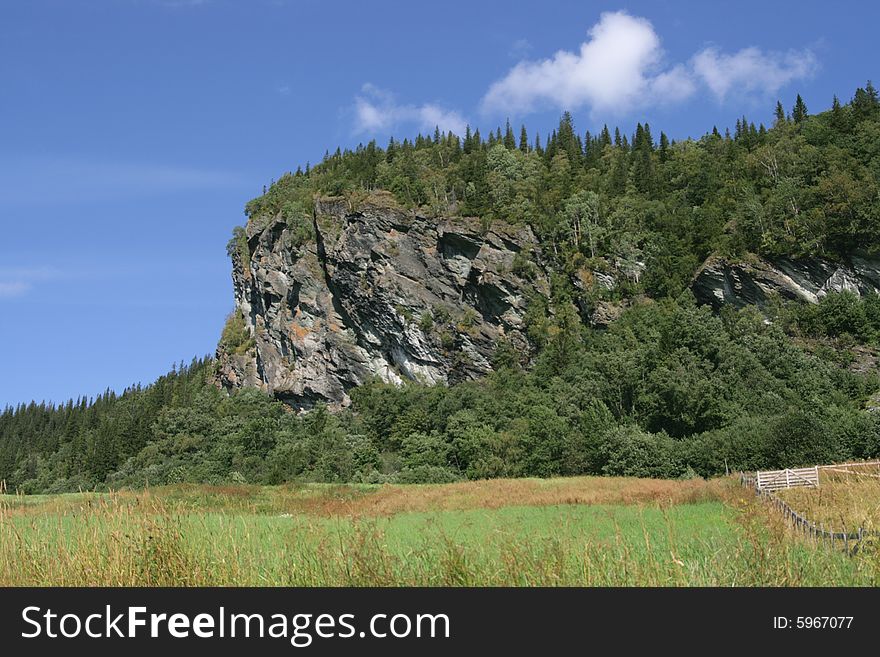 Steep cliff in a rural landscape in Norway