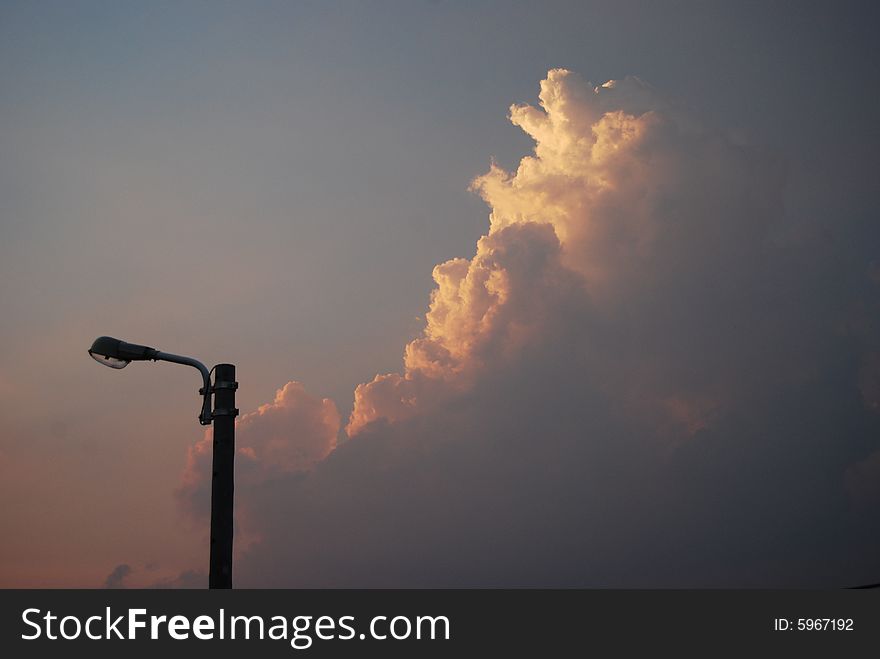 Street lamp and clouds before sunset. Street lamp and clouds before sunset